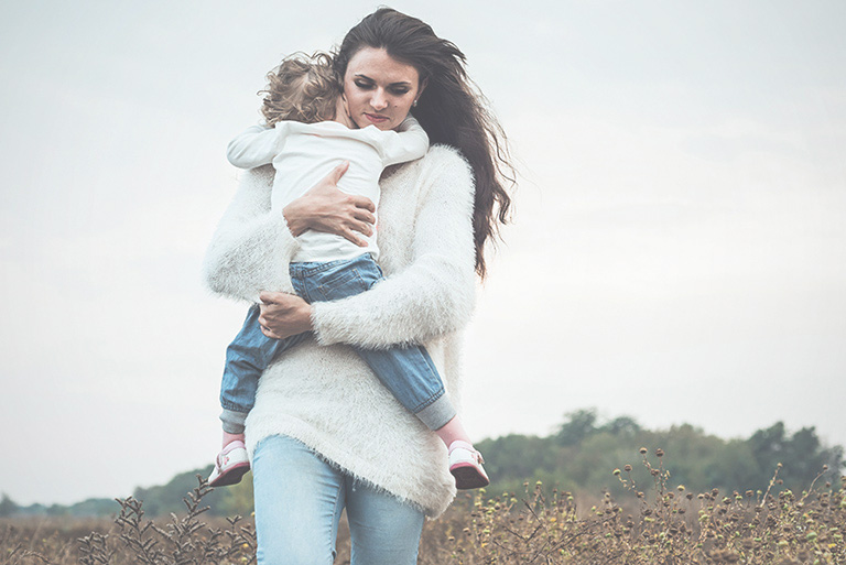 woman hugging son